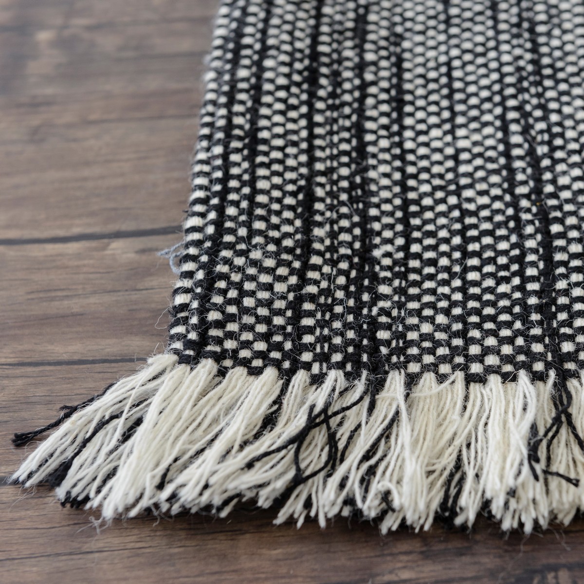 Wool Handloom Rug in Black With Contrasting Fringe