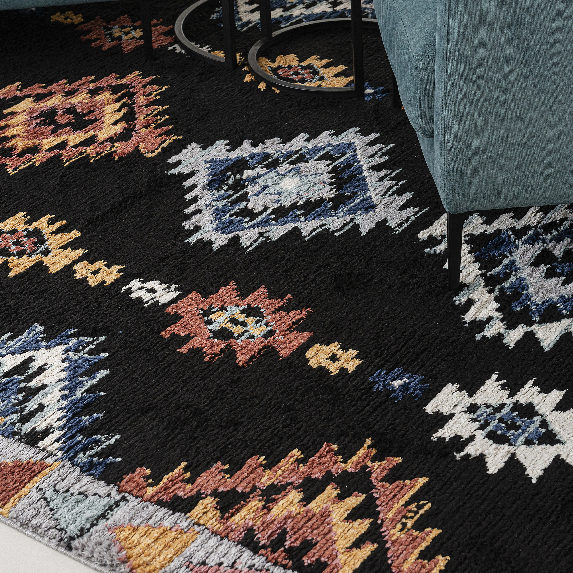 Power loomed tribal design rug 