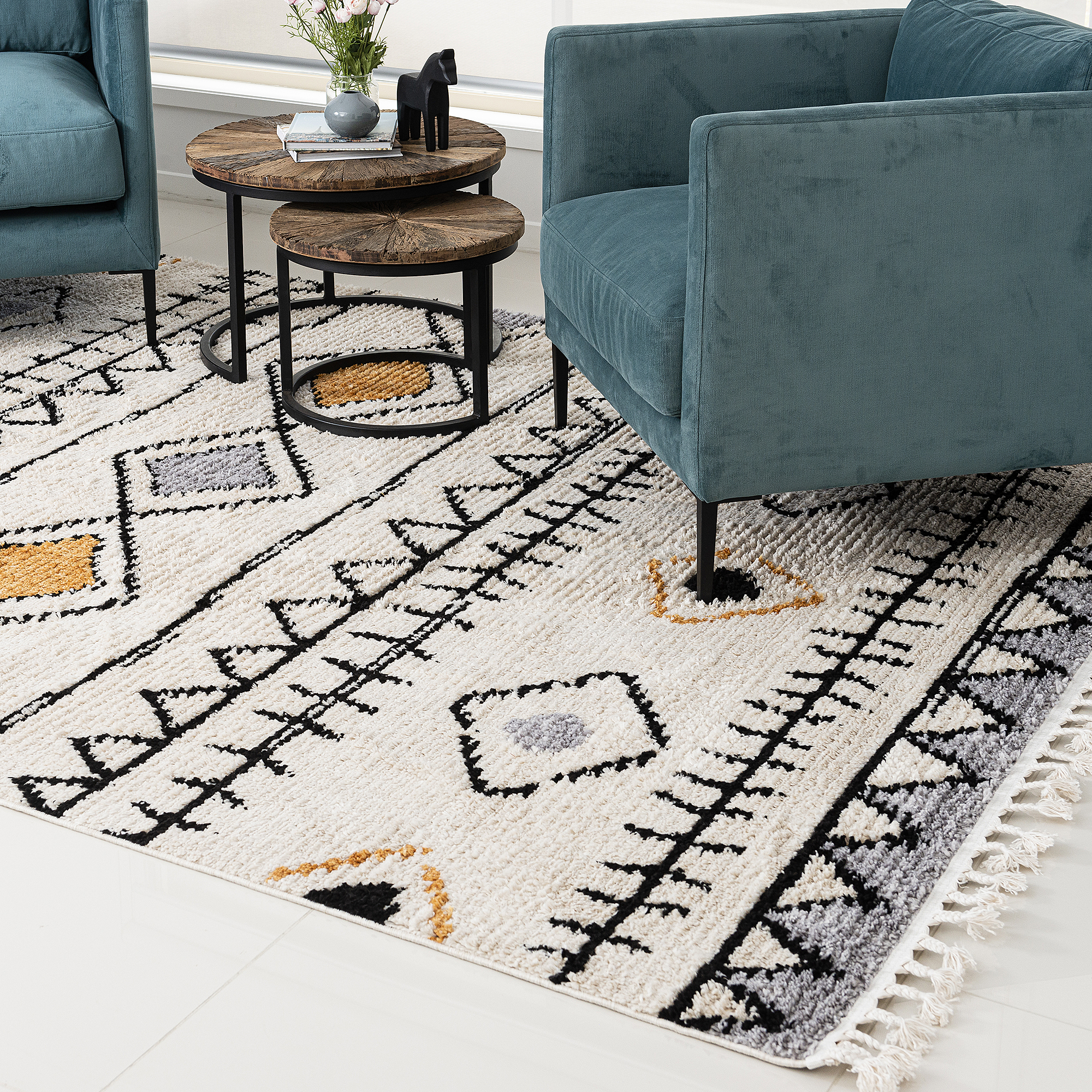 Power loomed tribal design rug 